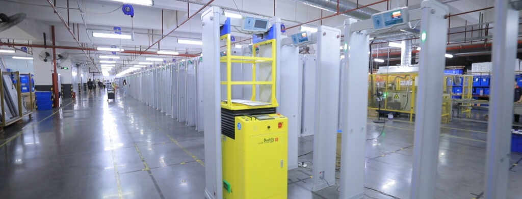 industrial robot lifting a metal detector